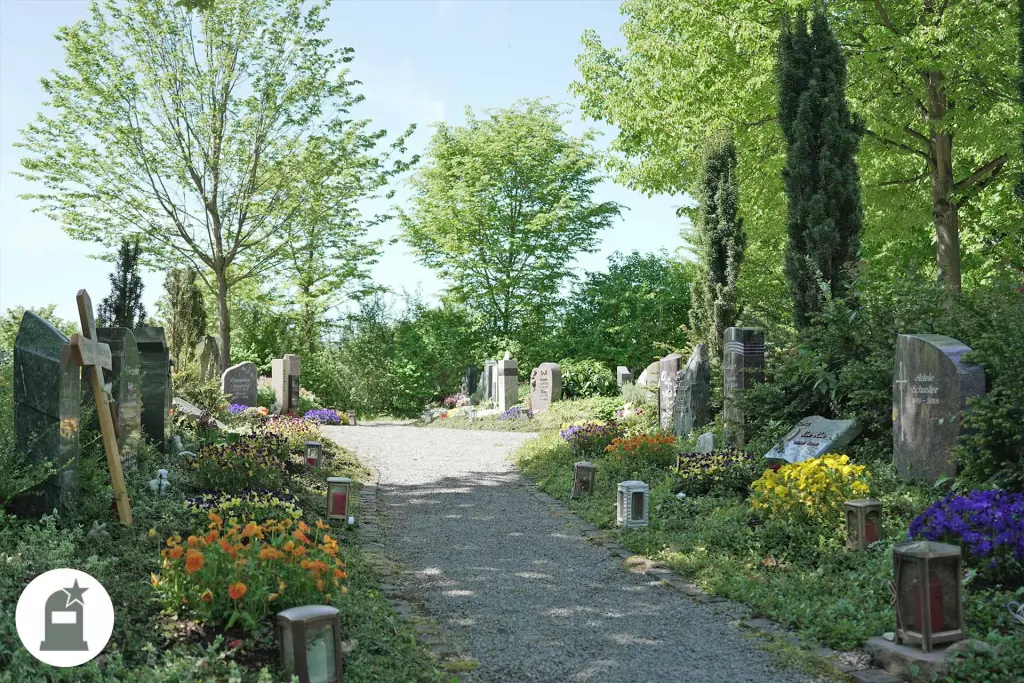 Friedhofsweg in Untergrombach mit blühenden Grabbeeten zu beiden Seiten